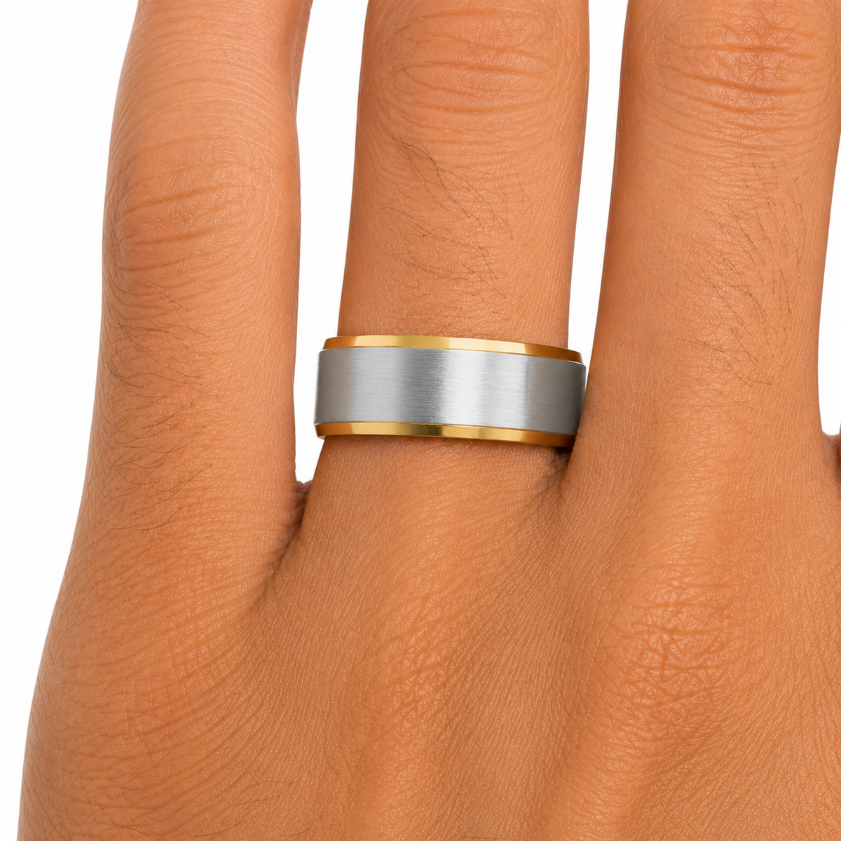 14K two-tone gold men’s wedding band with brushed white gold center and polished yellow gold edges shown on hand