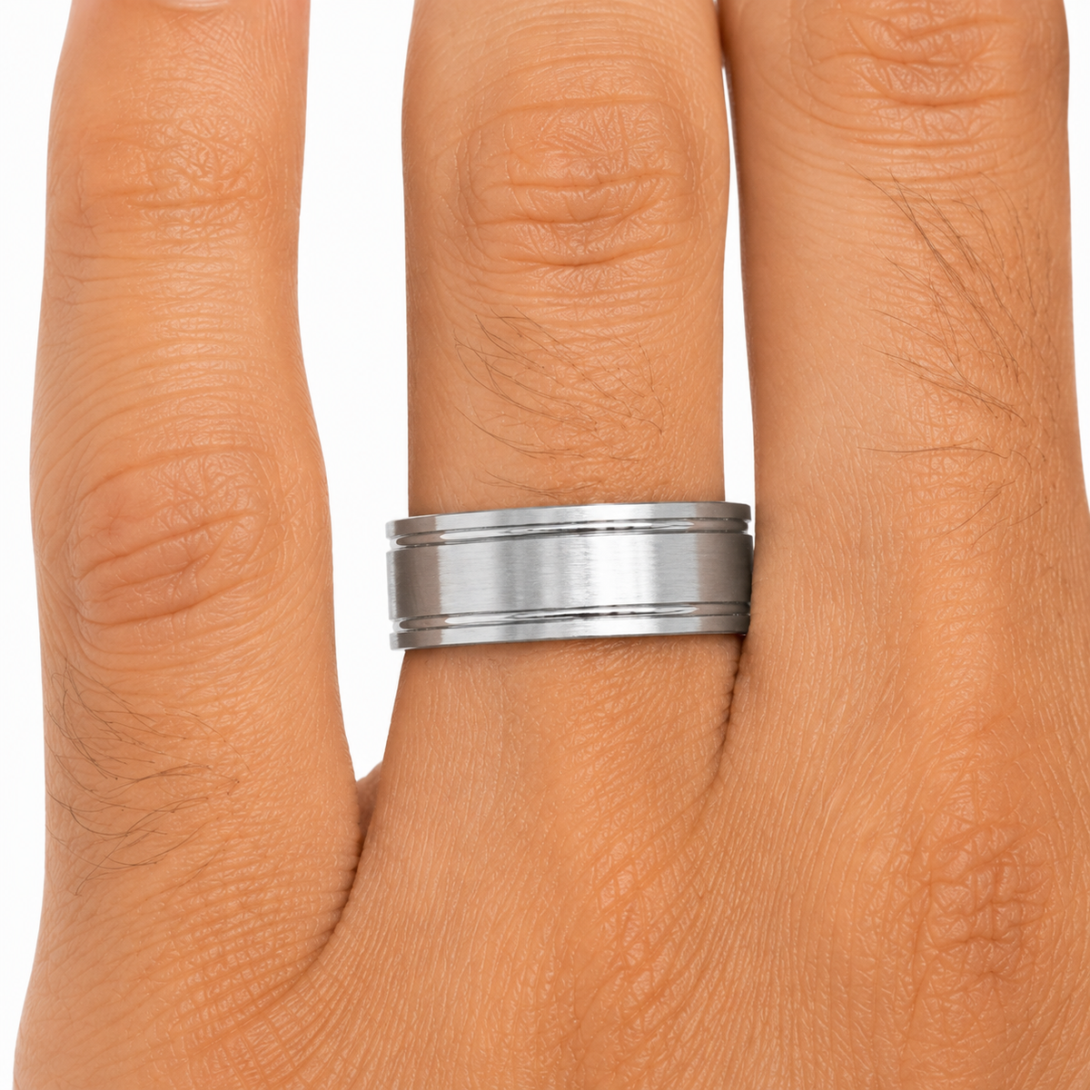 14K white gold 7mm men’s wedding band with brushed center and high polish accent grooves shown on hand