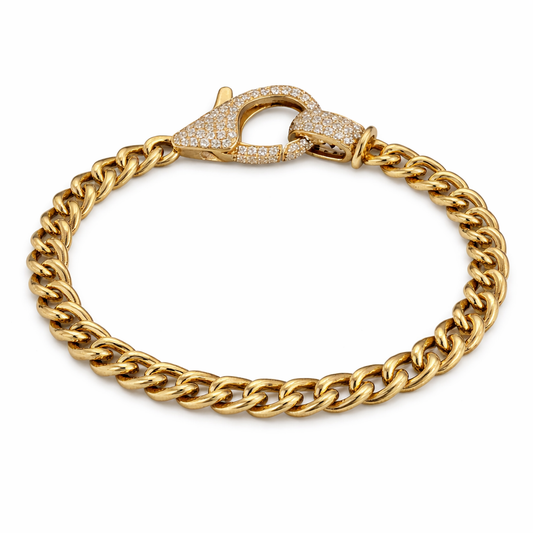 14K yellow gold Cuban link bracelet with diamond lobster clasp on white background from Isabella’s Fine Jewelry