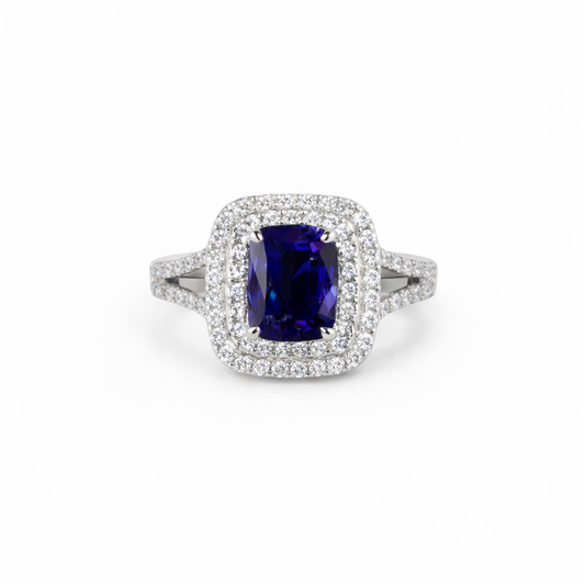 18KT Gold Halo Ring set with Blue Sapphire center stone and Diamonds