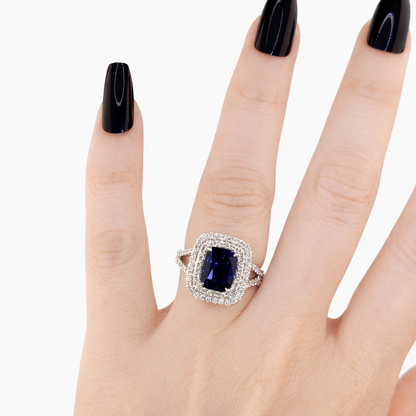 18KT Gold Halo Ring set with Blue Sapphire center stone and Diamonds