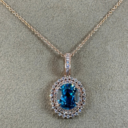 14KT Gold Halo Blue Zircon and Diamond Pendant