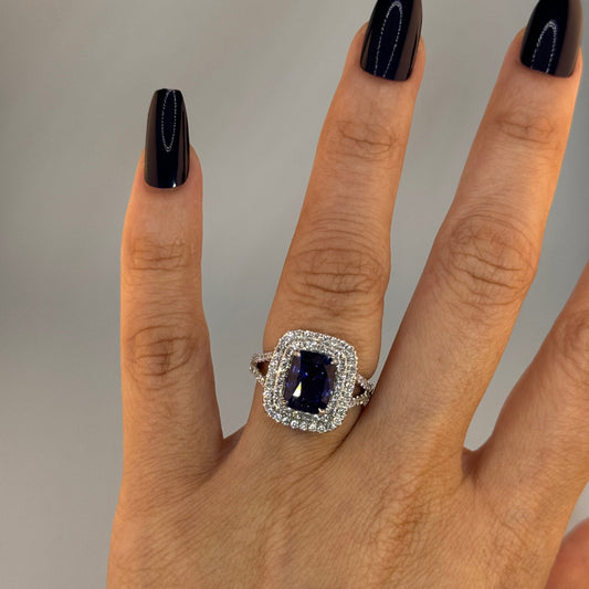 18KT Gold Halo Ring set with Blue Sapphire center stone and Diamonds