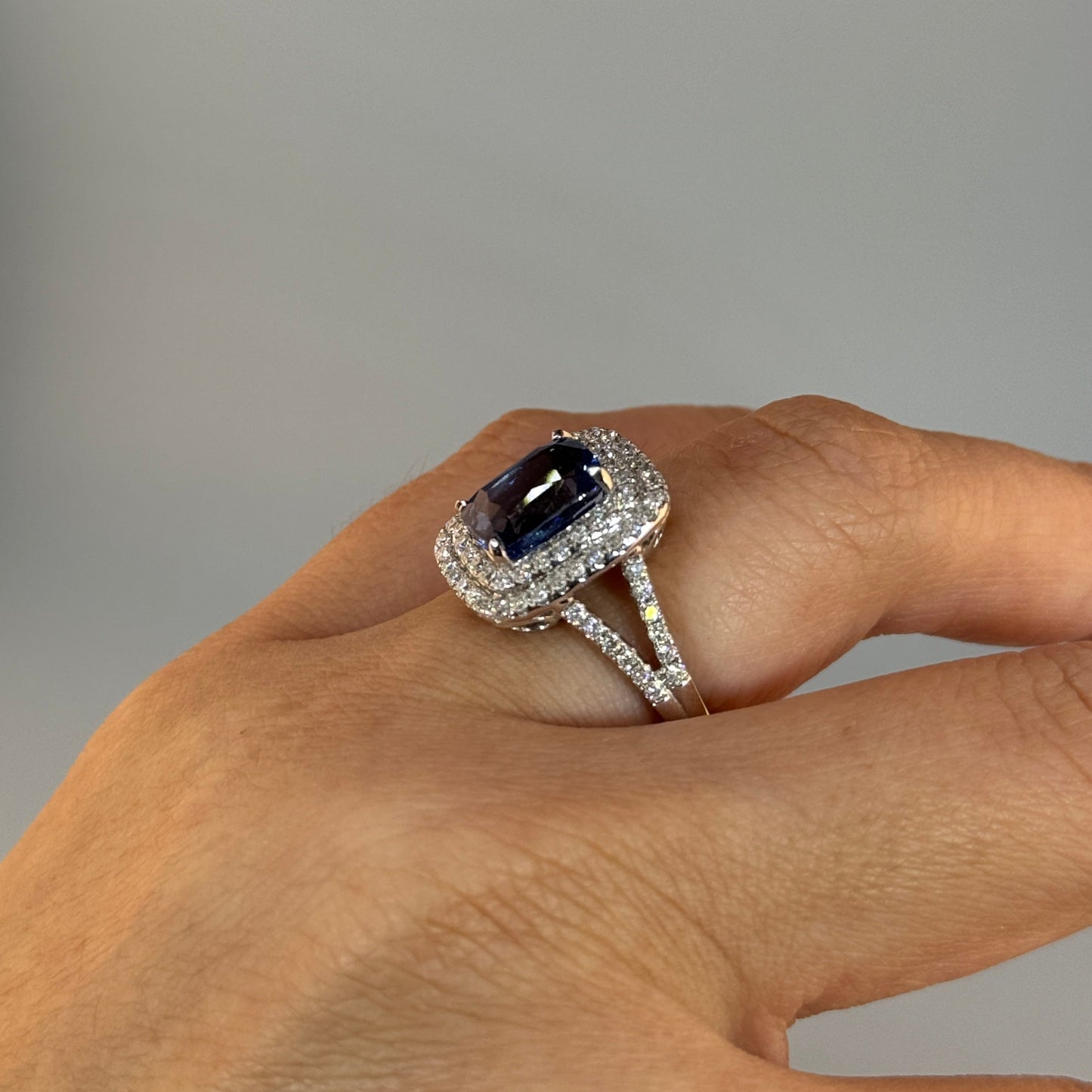 18KT Gold Halo Ring set with Blue Sapphire center stone and Diamonds