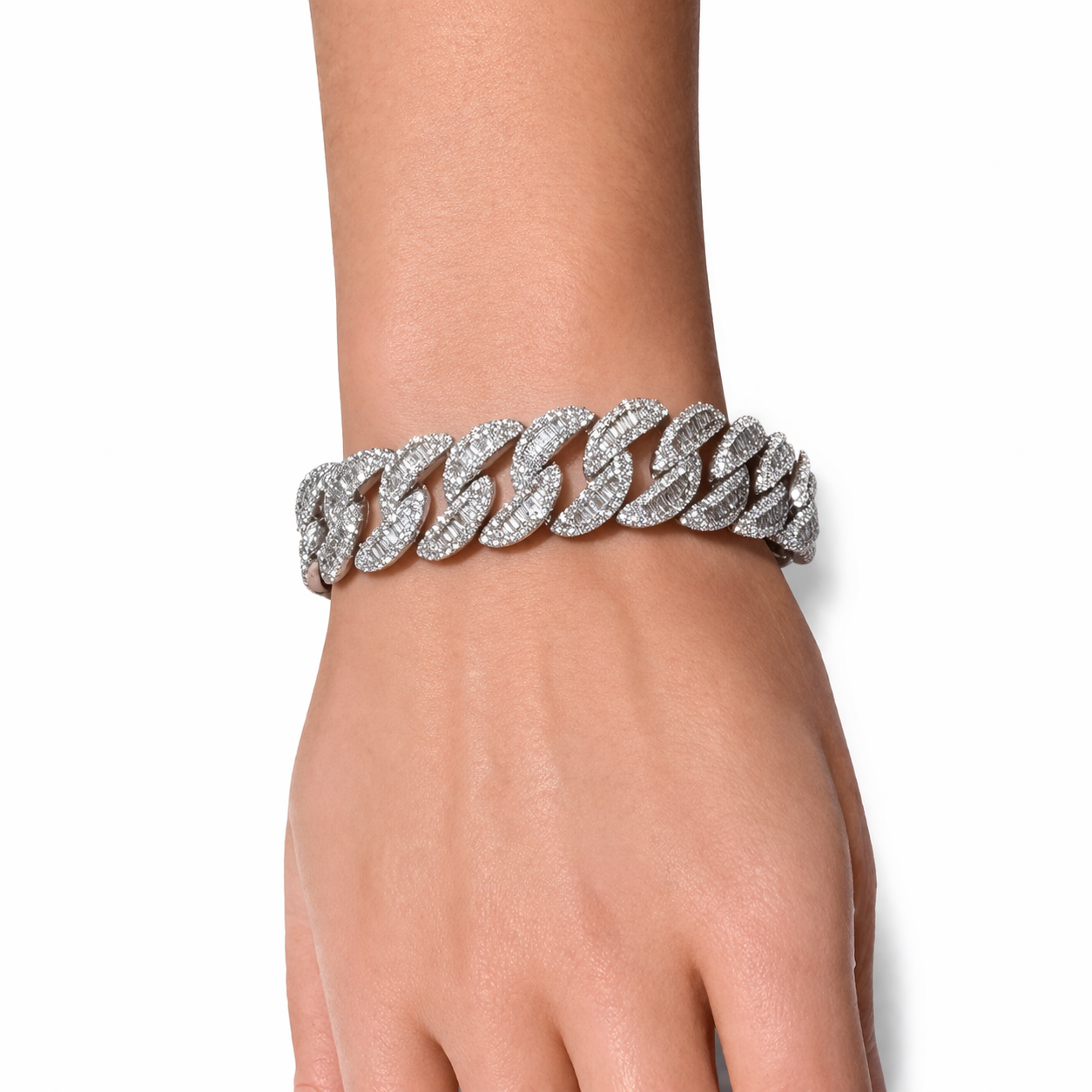 White gold diamond Cuban link bracelet worn on wrist in Huntington Beach Orange County featuring fully iced links with high brilliance diamonds