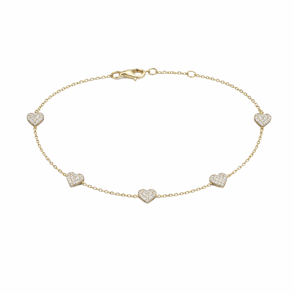 Yellow gold diamond heart station bracelet with pavé diamonds on white background available in Huntington Beach Orange County
