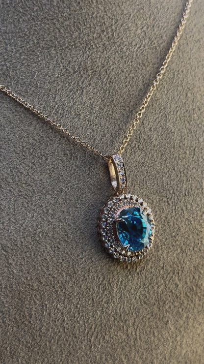 14KT Gold Halo Blue Zircon and Diamond Pendant