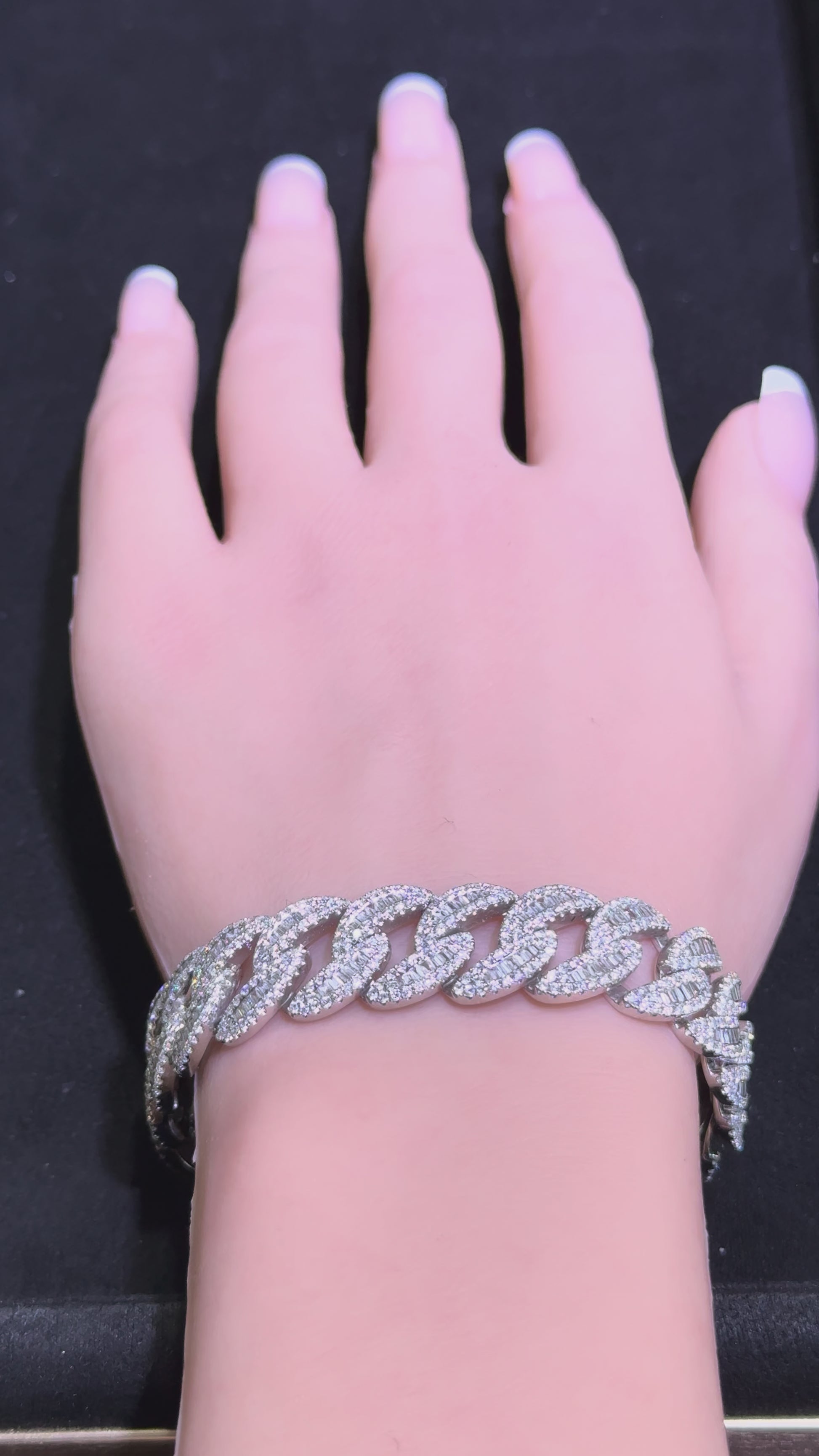 Video of white gold diamond Cuban link bracelet on wrist showing sparkle and movement in Huntington Beach Orange County