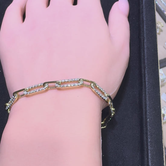 Video of 14KT yellow gold graduating paperclip diamond bracelet featuring 2.53 CTW natural diamonds on wrist
