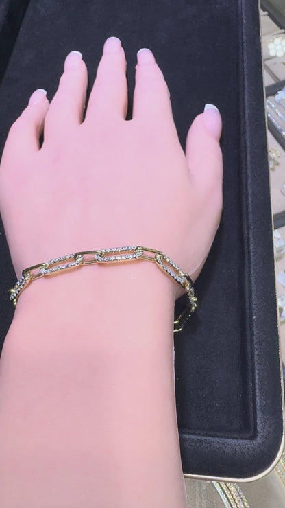 Video of 14KT yellow gold graduating paperclip diamond bracelet featuring 2.53 CTW natural diamonds on wrist