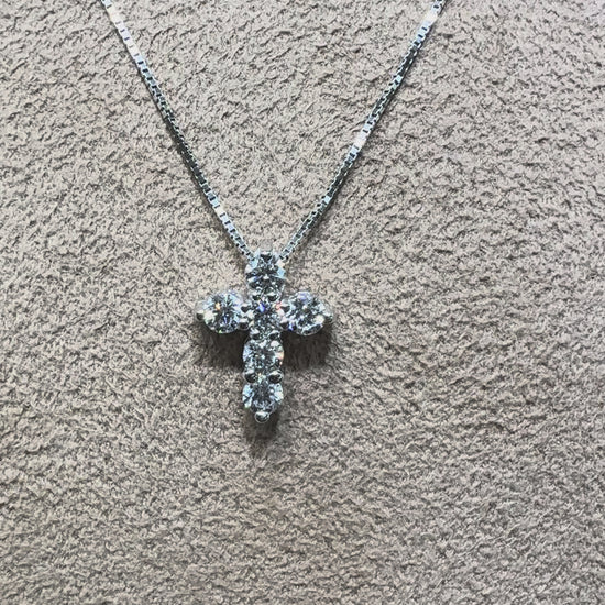 Video of a 14K gold diamond cross necklace featuring 0.46 carats total weight of round brilliant diamonds on a delicate chain, available in white gold, yellow gold, and rose gold.