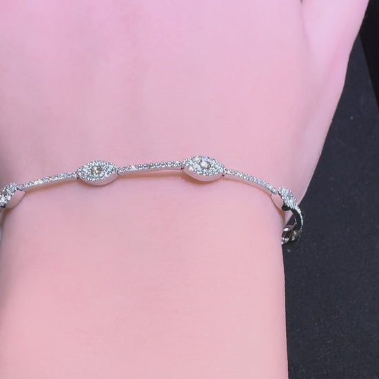 14k white gold diamond marquise station bracelet sparkling on wrist with pavé diamonds Huntington Beach Orange County