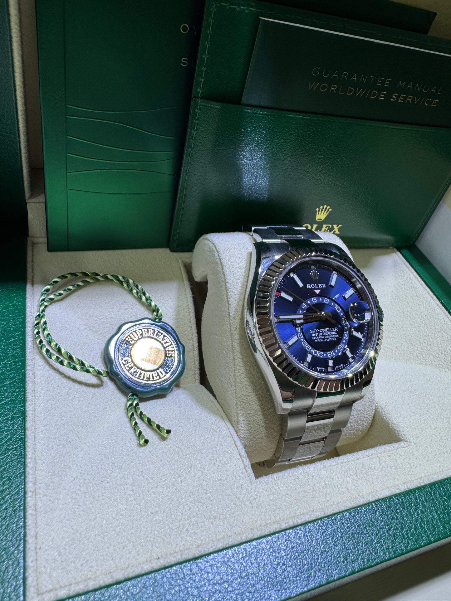 Rolex Sky-Dweller blue dial full kit with Oyster bracelet displayed at Isabella’s Fine Jewelry Orange County