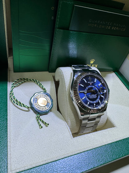Rolex Sky-Dweller blue dial full kit with Oyster bracelet displayed at Isabella’s Fine Jewelry Orange County